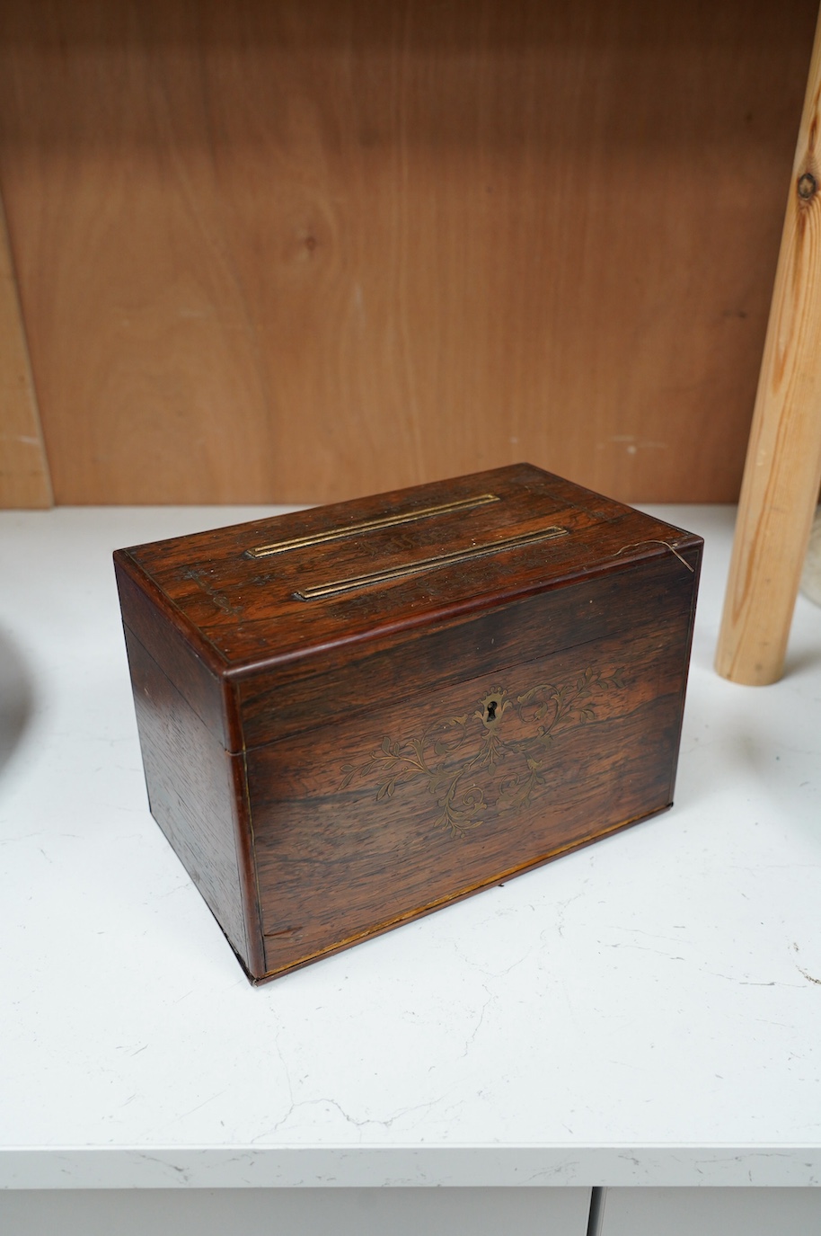 A George IV cut brass inlaid rosewood ‘letters’ box, satinwood interior, 23cm wide. Condition - fair